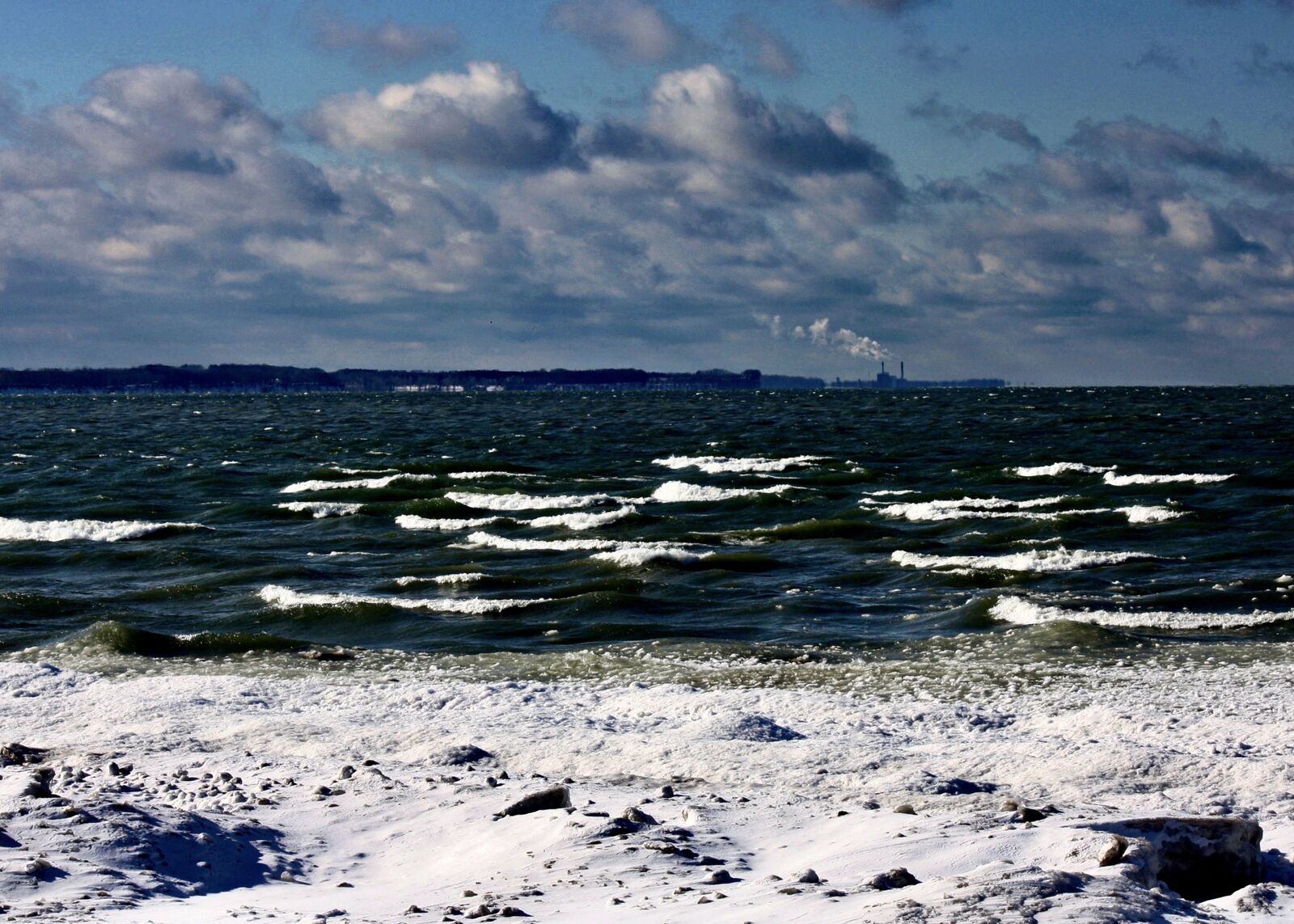 Waves on Lake Erie under dramatic clouds seen from the Brant shoreline
