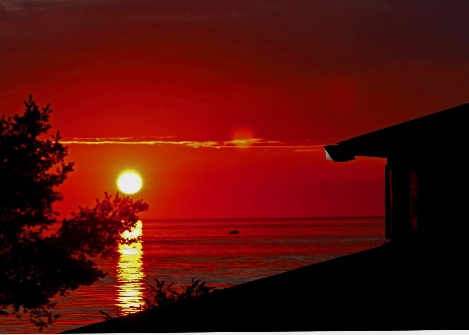 Vivid red sunset over Lake Erie from the Evans shoreline