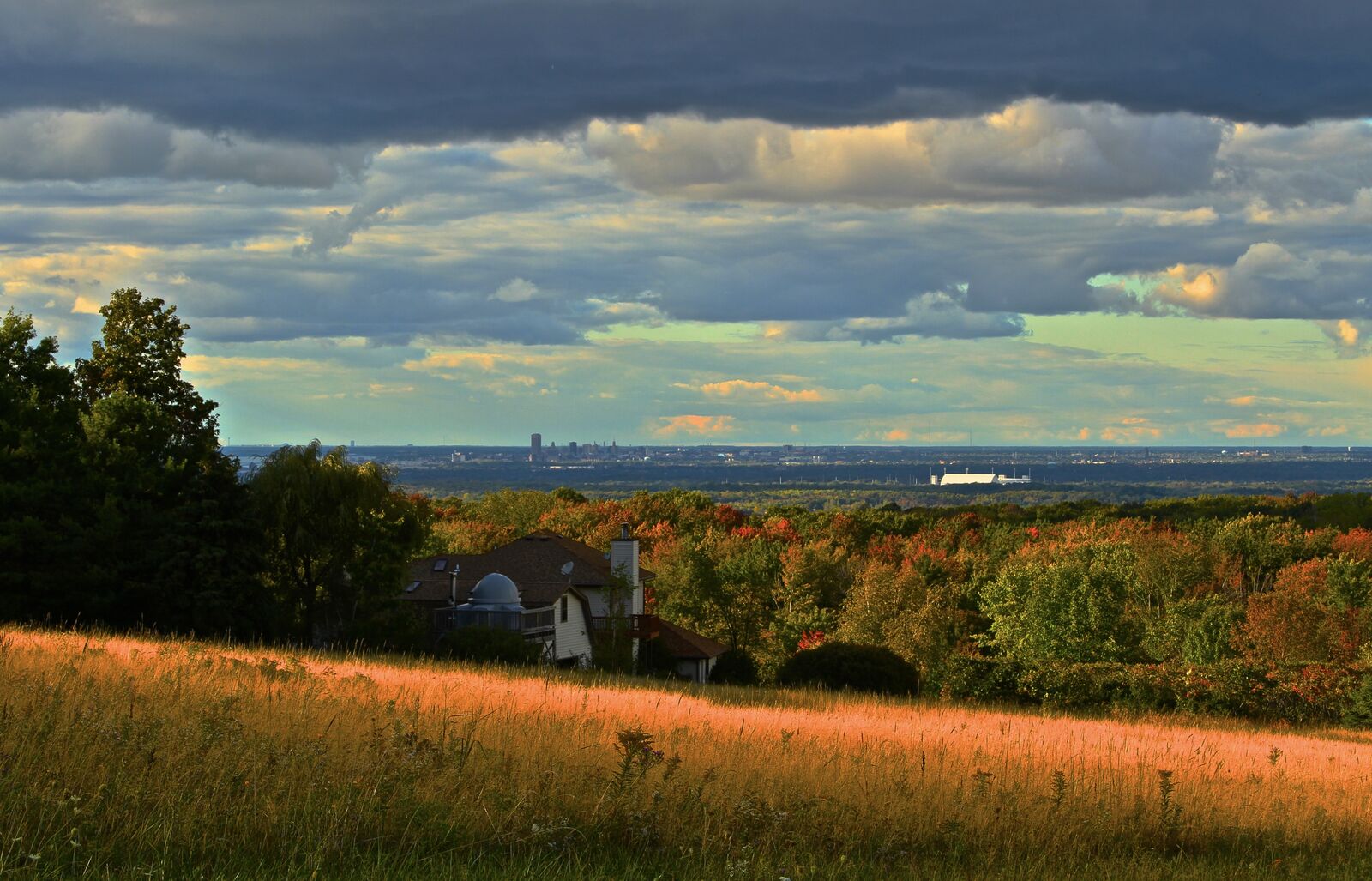 Hilltop view of the Buffalo skyline and stadium from Orchard Park at golden hour